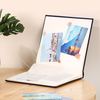 photo album with paper between pages